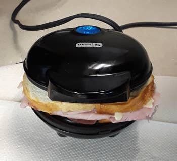 Reviewer image of black panini press grilling sandwich