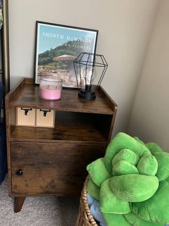 reviewer photo of wooden nightstand in a bedroom