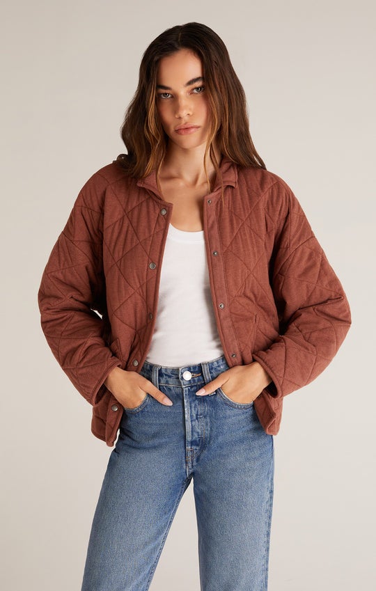 model wearing jacket in whiskey with blue jeans