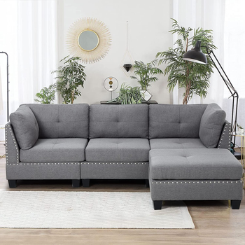 the grey tufted and studded sectional sofa