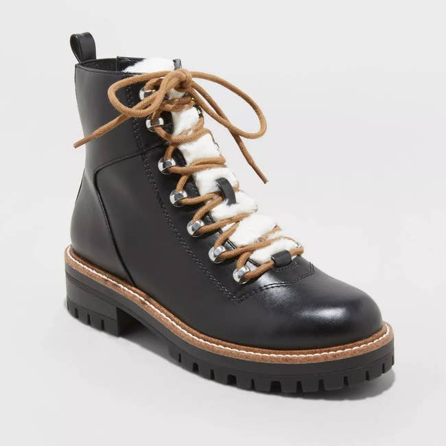 the black hiking boots with brown laces