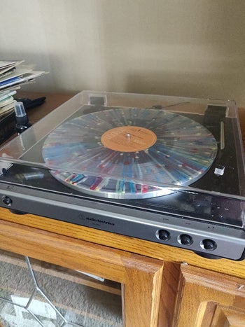 a reviewer's turntable with a record on it