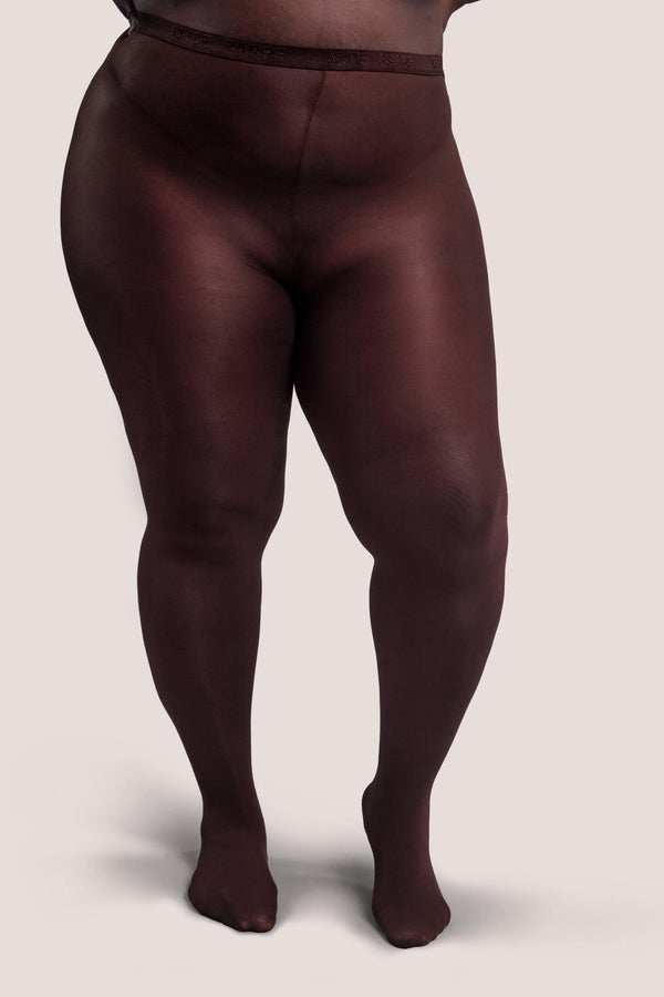plus-size model with dark skin wearing the tights