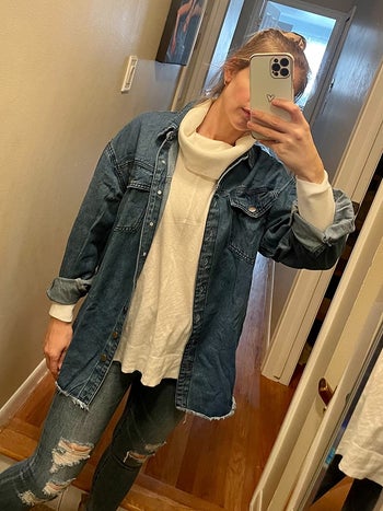 reviewer mirror selfie wearing denim shacket over white turtleneck