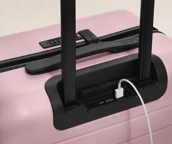 close up of the USB charging port on the pink carry on