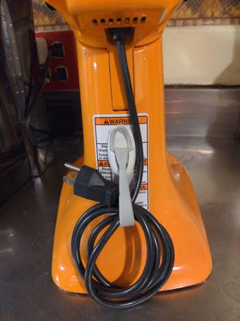 reviewer photo of the cord bundler being used for a stand mixer wire