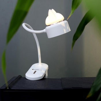 a white clamp lamp with cat ears nightlight