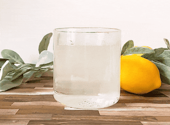 gif of a hand putting a fizzie in a glass of water with it bubbling up