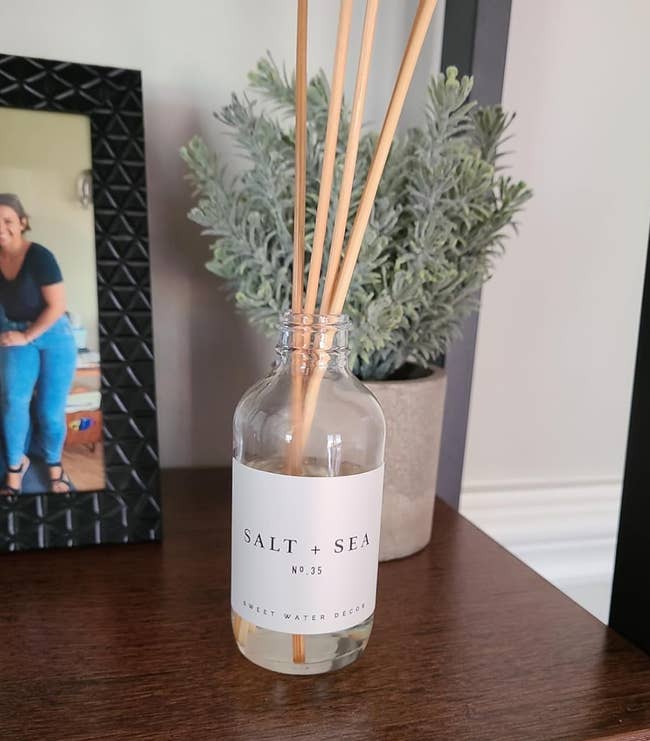 A reed diffuser labeled 