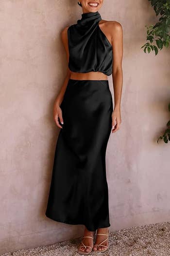 Elegant two-piece evening wear with a halter neck top and long skirt