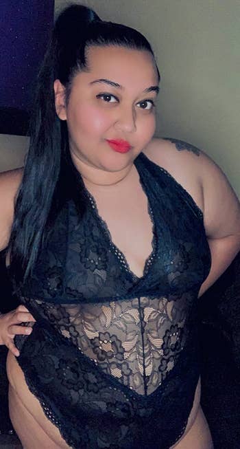 A reviewer wearing the bodysuit in black
