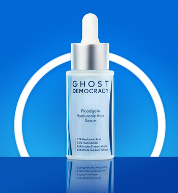 Container of clear serum with dispensing wand