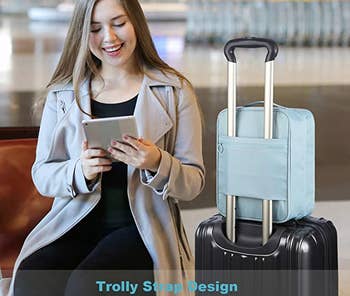 model sitting next to a suitcase that the blue shoe pouch is attached to via its trolley slot