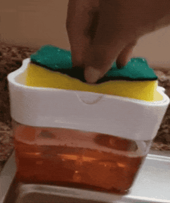 Reviewer gif of them pushing the sponge down to dispense the soap into it