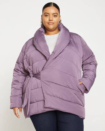 a model wearing the same coat in light purple 