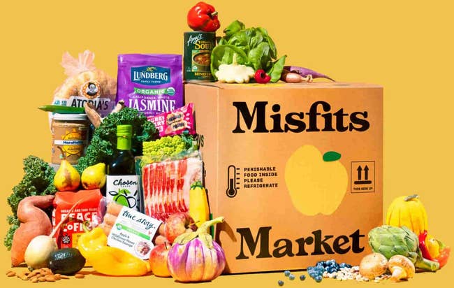a Misfits Market box surrounded by various types of groceries 