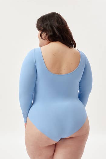 model showing the bodysuit with the scooped back