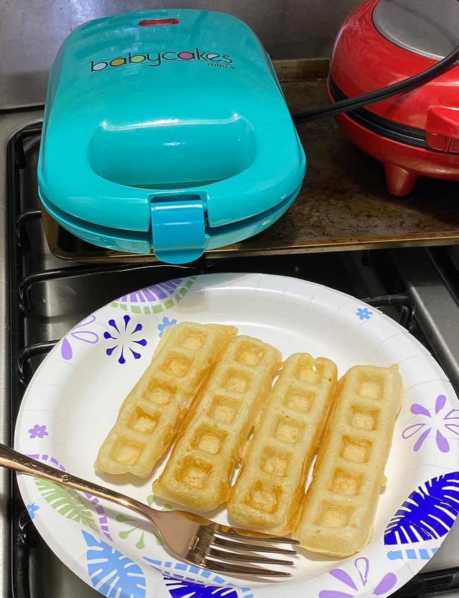 reviewer image of the waffle stick maker next to a plate of waffle sticks