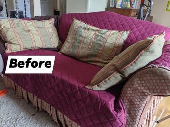 reviewer's old couch covered in magenta quilted cover