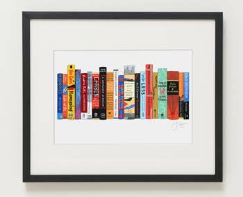horizontal print of books in a black frame