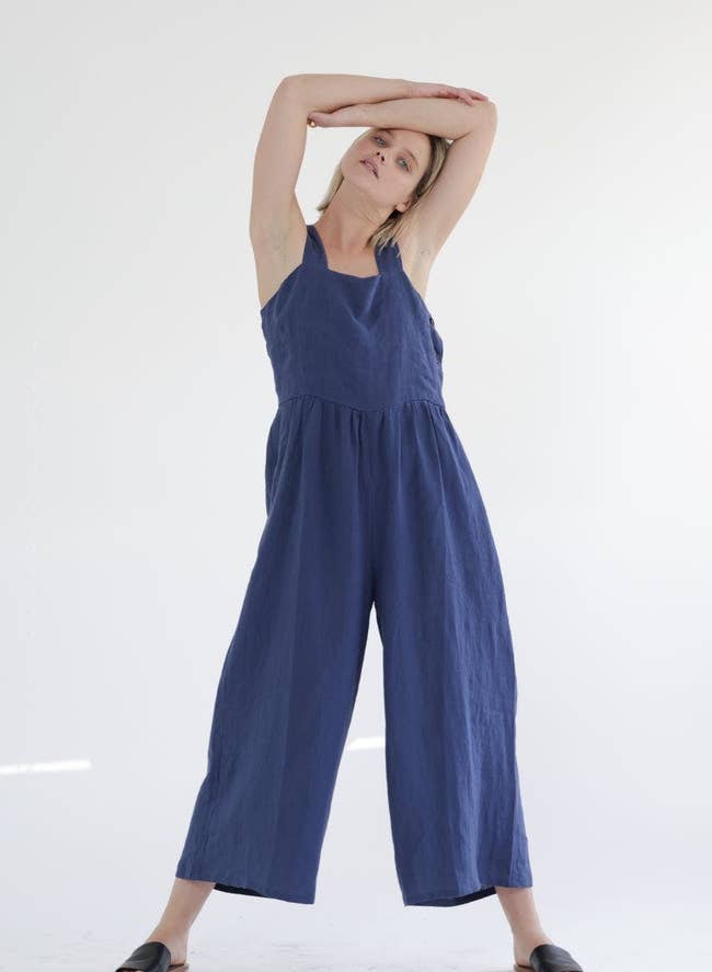 model wearing the blue flowy linen jumpsuit