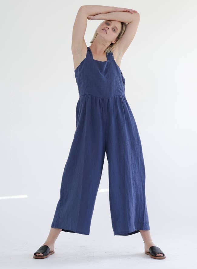 model wearing the blue flowy linen jumpsuit