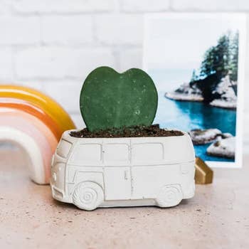 side view of a hippie van planter in white concrete