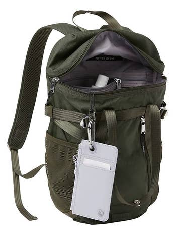 an open green hiking backpack