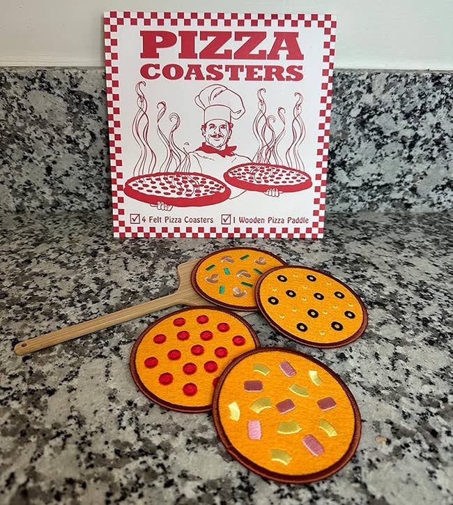 four pizza coaster and a woody paddle