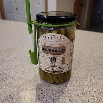 reviewer image of the fork attached to a jar of asparagus
