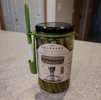 reviewer image of the fork attached to a jar of asparagus