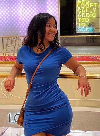reviewer in the blue bodycon dress