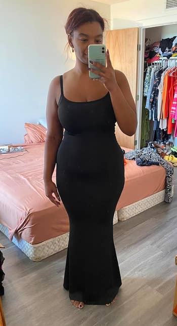 a reviewer wearing the dress in black 
