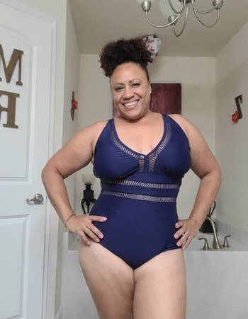 reviewer wearing the swimsuit in blue