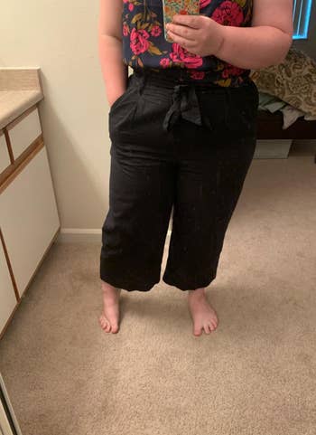 reviewer mirror selfie wearing black paperbag pants