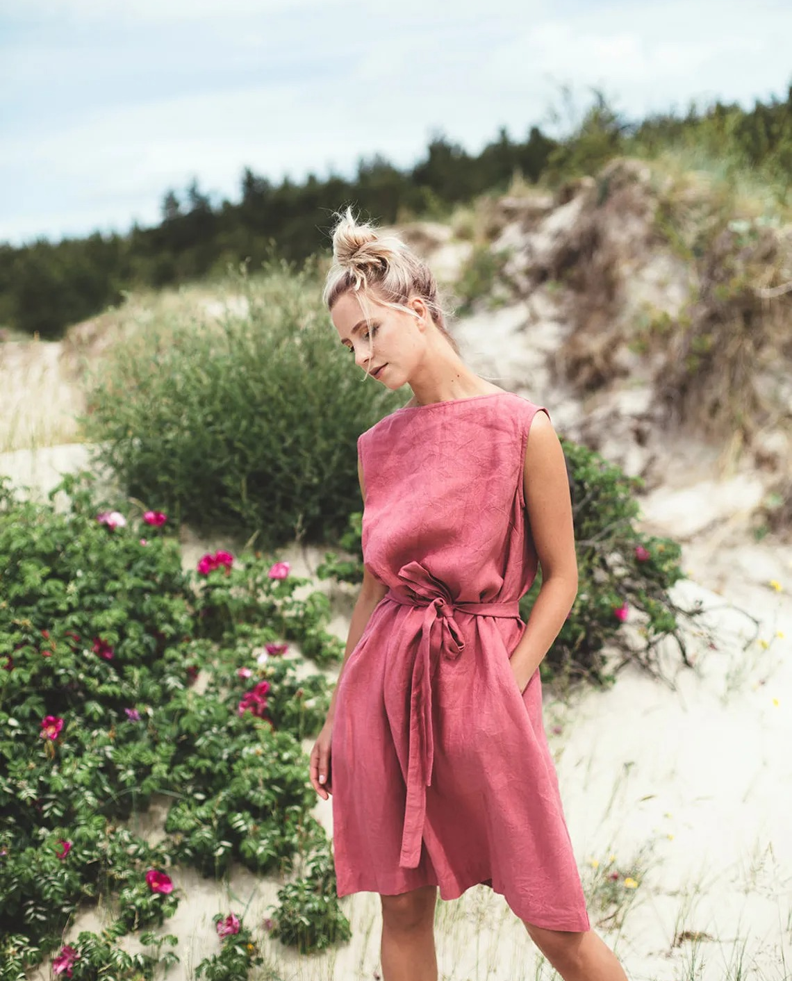 a model in the watermelon colored linen dress