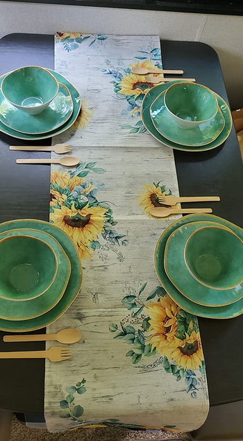 a reviewer photo of the dinnerware in green set up in an RV