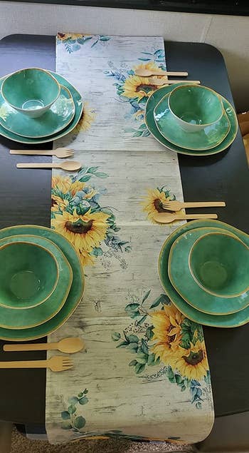 a reviewer photo of the dinnerware in green set up in an RV 