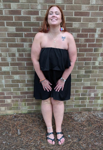 reviewer wearing the strapless black dre