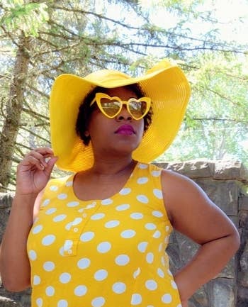 close-up of Tasia wearing both accessories with a yellow polka-dot top