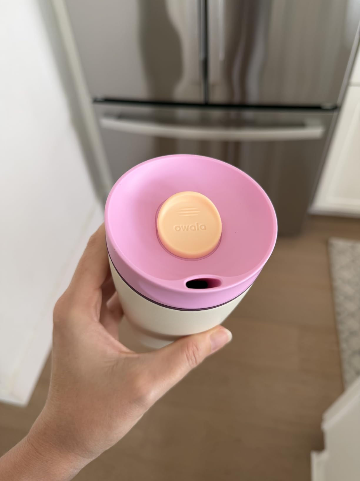 reviewer holding the FreeSip shown from supra  with slider visible