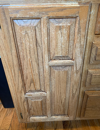 reviewer's kitchen cabinet looking worn down