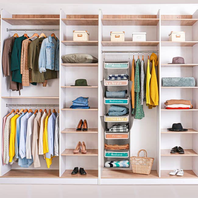 organized closet with one section holding the daily outfit organizer slots 