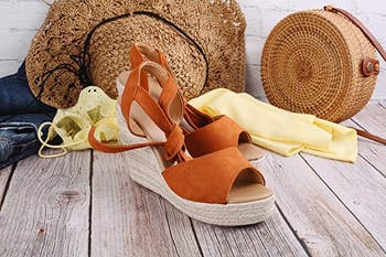 the tan wedges next to some summer accessories