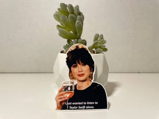 sticker of Jess from New Girl holding rosé and saying 