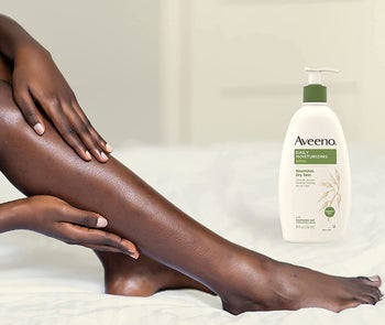 model's legs next to the bottle of lotion