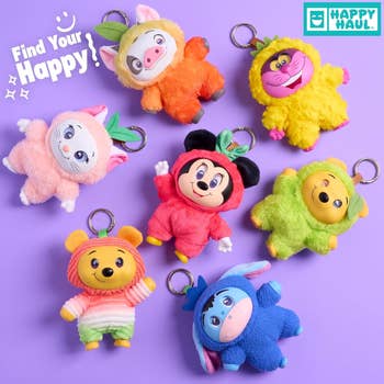Plush Disney character keychains are arranged in a circle, with 