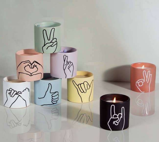 various candles with different hand signals on them