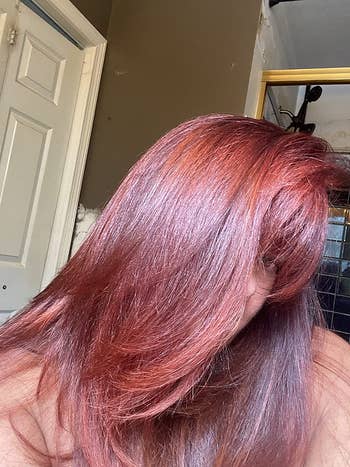 image of reviewer with shiny and healthy straight red hair