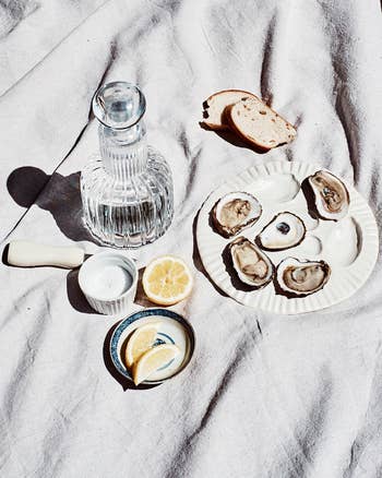 oysters on oyster plate on picnic blanket